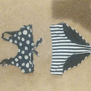 GirlsNavy blue bikini top with flowers and navy blue bottoms with white stripes
